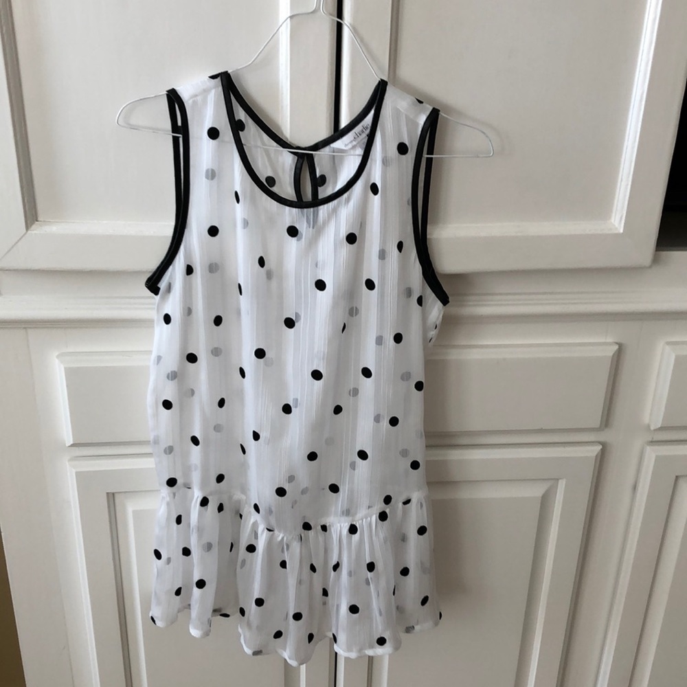 Cute ruffled bottom sleeveless shirt